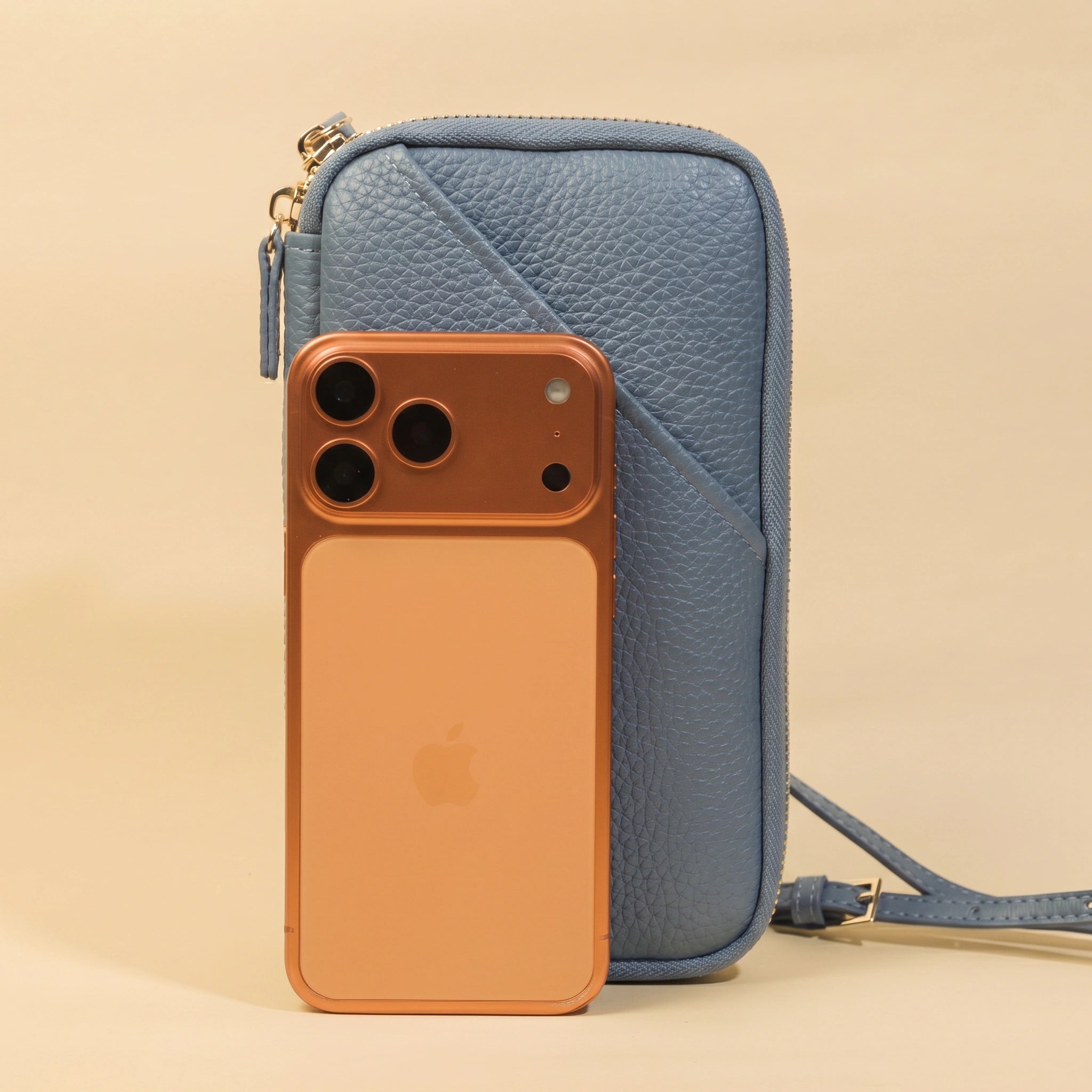 Phone Bag with iPhone on a beige background