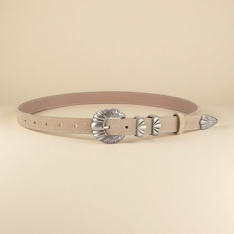 Beige leather belt with silver buckle on a beige background